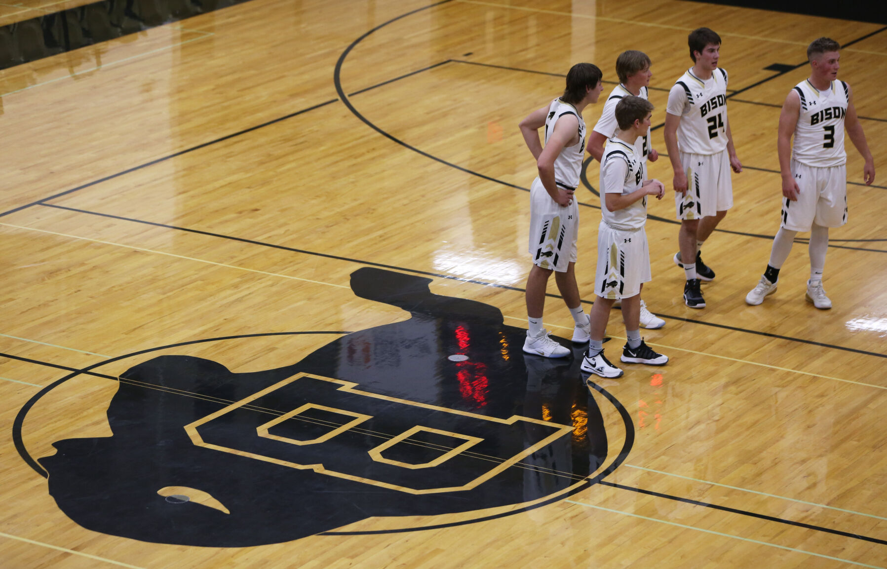 Buffalo’s second half starters wait in the middle of the court